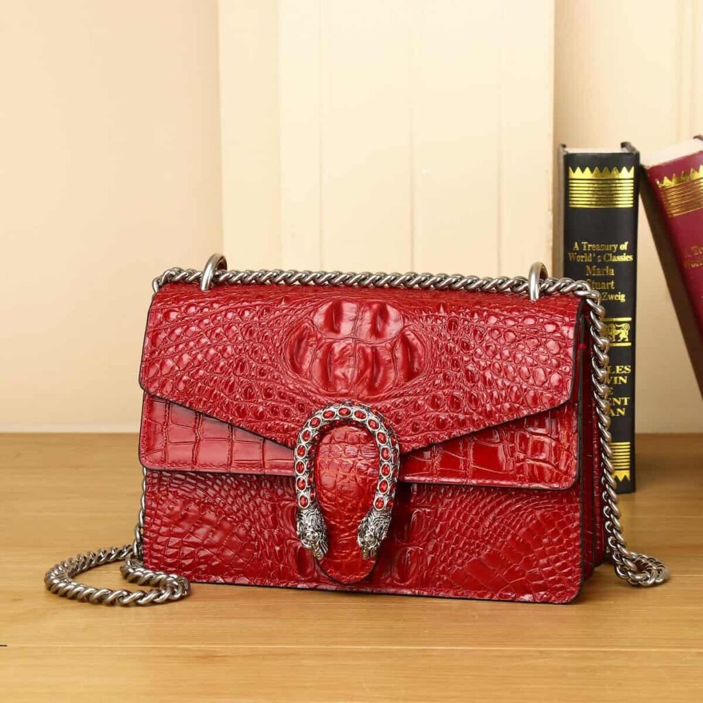 Women's leather bag with crocodile pattern. Small chain bag, Os de Bacchus design, red.