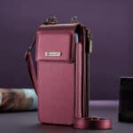 Fuchsia pink leather bag with a front pocket and adjustable shoulder strap; an elegant and practical style.